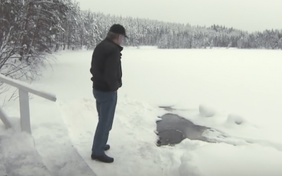 He Slowly Approaches This Frozen Hole At The Lake. What Pops Out Is So UNEXPECTED