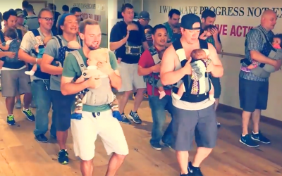 Dads Line Up In Formation With Babies In Kangaroo Carriers. But When The Song Begins PRICELESS
