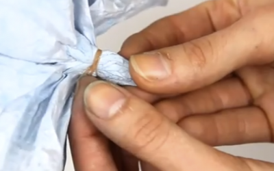 Woman Places A Rubber Band Around This Coffee Filter And Dunks It In Water. WATCH What It Becomes!