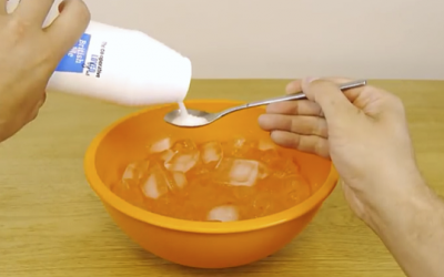 He Sprinkles Salt Into This Bowl Of Ice Then Places A Can Of Soda In It. The Reason Is Brilliant