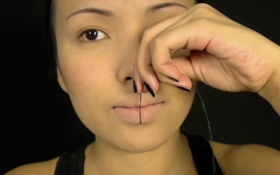 She Presses A Needle and String Onto Her Lips. The End Result Is So Trippy!
