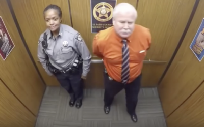 Hidden Security Camera Films Cops In An Elevator.