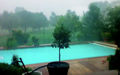 They Film Their Pool As The Dark Clouds Come Rolling In.